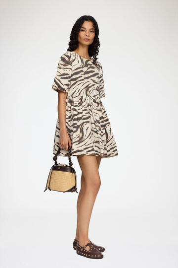 Model wearing short zebra denim dress